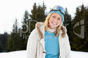 Young Woman  In Alpine Snow Scene
