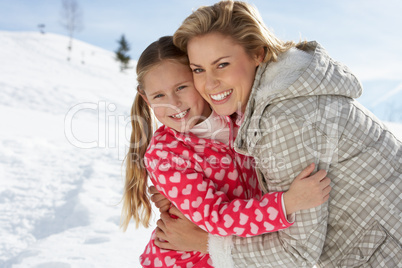 Young Mother And Daughter On Winter Vacation