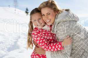 Young Mother And Daughter On Winter Vacation