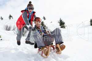 Young Father And Son Sledding