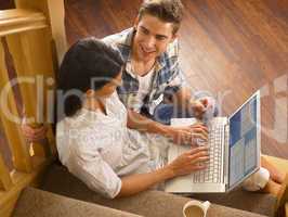 Young Hispanic couple shopping online