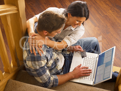 Young Hispanic couple shopping online