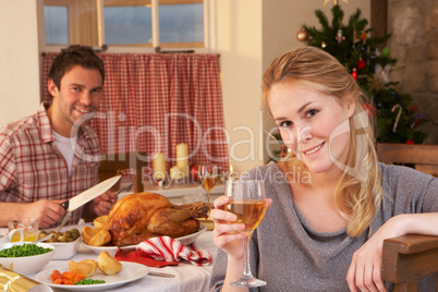 Young couple having Christmas dinner