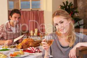 Young couple having Christmas dinner