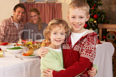 Young family at Christmas dinner table