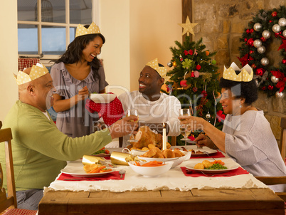 Adult African American family having Christmas dinner