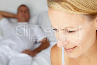 Mid age couple in bedroom