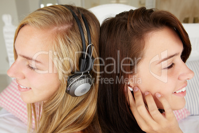 Teenage girls listening to music