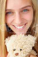 Close up teenage girl with cuddly toy