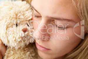 Close up teenage girl with cuddly toy