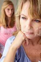 Unhappy mother with teenage girl