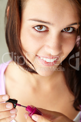 Teenage girl painting nails