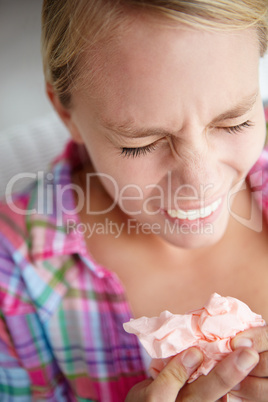 Teenage girl sneezing