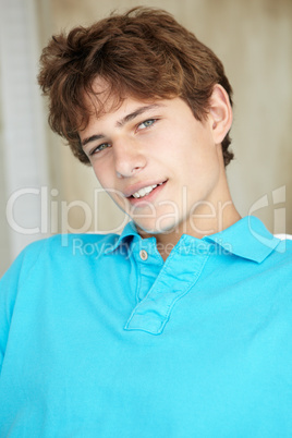 Portrait teenage boy at home