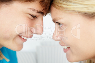 Teenage boy and girl close up profile