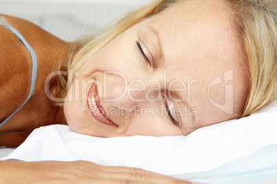 Head and shoulders mid age woman sleeping