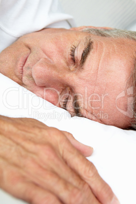 Head and shoulders mid age man sleeping