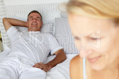 Mid age couple in bedroom
