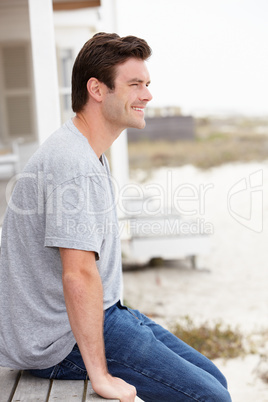 Portrait man sitting outdoors