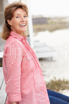 Senior woman sitting outdoors