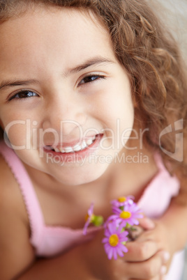 Young girl holding flowers