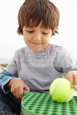 Young boy with bat and ball