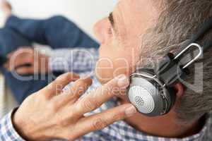 Mid age man wearing headphones