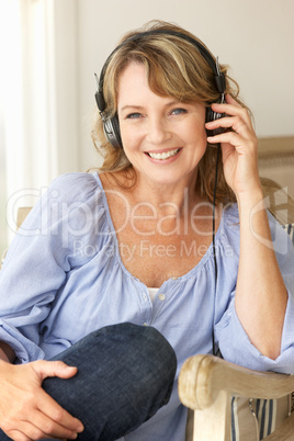 Mid age woman wearing headphones