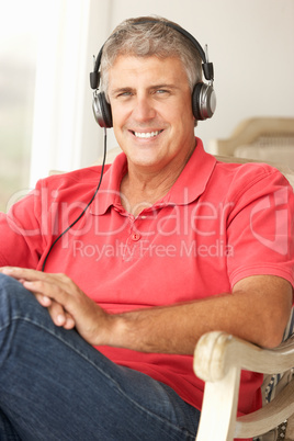 Mid age man wearing headphones