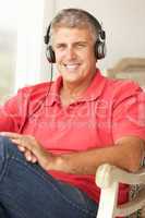 Mid age man wearing headphones