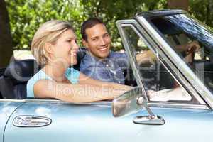 Couple in sports car