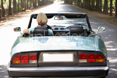 Woman in sports car