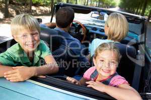 family in sports car