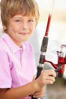 Young boy with fishing rod
