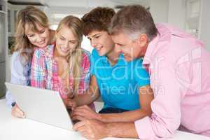 Family using laptop