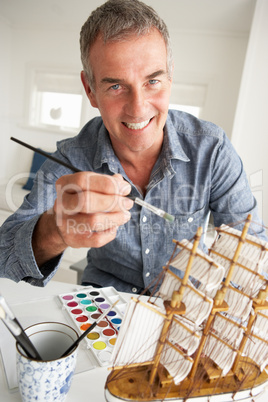 Mid age man model making