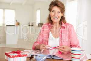 Senior woman scrapbooking