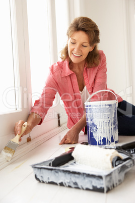 Senior woman decorating house