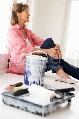 Senior woman decorating house