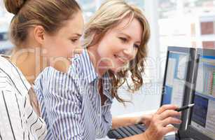 Businesswomen working on computers