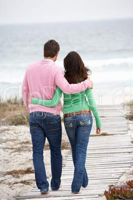 Couple walking by the sea