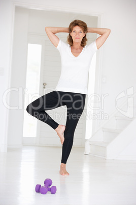 Senior woman in yoga position