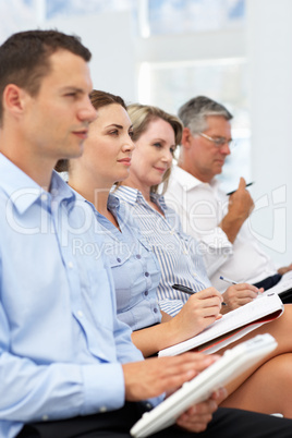 Group watching business presentation