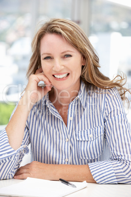 Successful mid age businesswoman on phone