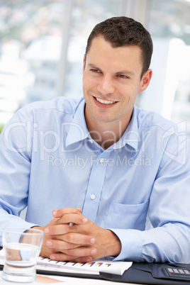 Young businessman at desk