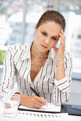 Thoughtful young businesswoman