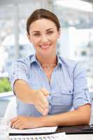Businesswoman offering hand in greeting