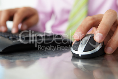Close up man using  keyboard and mouse