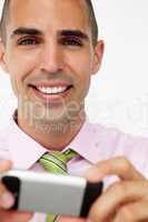 Young businessman using cellphone