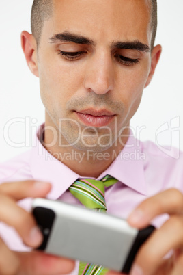 Young businessman using cellphone